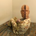 Smiling Inside, 2011 --- Self wearing wooden mask of Father's head 70 x 93cm Photography; C-type Lambda print, framed in brown