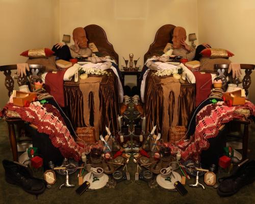The Empathetic vs the Mimic (collected parents' possessions in pairs, arranged as if mirror-image, with partner and self performing as my dad), 2011