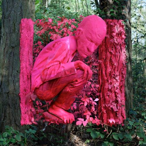 Natural Inside (self wearing upscaled mask of my dad's head, within neon pink painted square of woodland), 2011